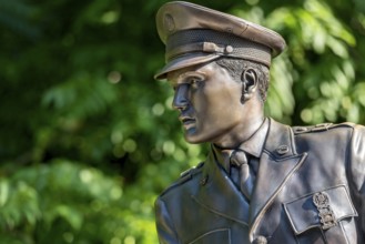 Bronze statue, monument to rock singer Elvis Presley, King of Rock 'n' Roll in uniform of the 3rd