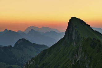 Tierberg at dawn, behind it the Appenzell Alps with Alpstein, cantons of Glarus and St. Gallen,