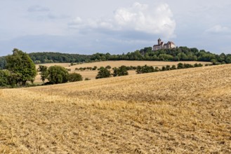 Ronneburg Castle, knight's castle from the Middle Ages, harvested grain fields, field, hill,