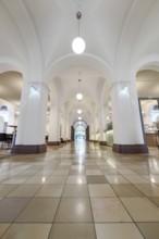 Bright building corridor with arches and hanging lights, University of Stuttgart, Germany, Europe