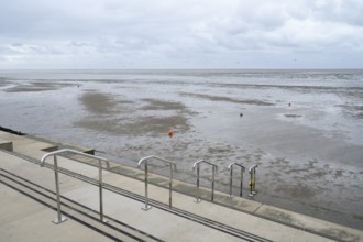 Steps to the North Sea, low tide, kite surfers behind, Lower Saxony Wadden Sea National Park,