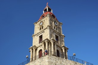 Clock Tower, Historic consecrated tower with clock and red roof, under a clear blue sky, dominant