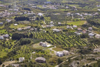 View from Filerimos hill, aerial view of a green village with scattered houses, fields and hills