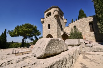 Monastery of Our Lady of Mount Filerimos, A medieval stone tower on a sunny day surrounded by