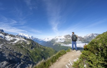 Mountaineer on a hiking trail, view into the valley with summit Mont Blanc, Chamonix, Haute-Savoie,