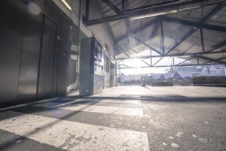 Entrance area with light beams and city view through the steel structure, Kaufland Calw