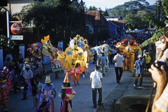 People in colourful costumes at the carnival parade, Port of Spain, Trinidad 1963 with the title