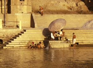 Hindus bathing in the holy river Ganges in Varanasi, India, 1974, Asia