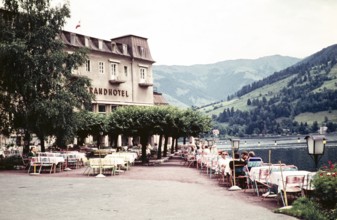 People sitting at tables on the terrace of the Seecafé, Grand Hotel, Zell am See, Austria, Europe