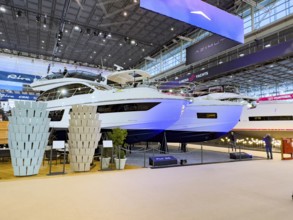 View of exhibition stand with luxury yacht superyacht ship boat in front Azimut Fly 53 behind