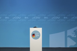 Election event for the Bundestag elections. Empty stage with lectern and logo of the CDU party and