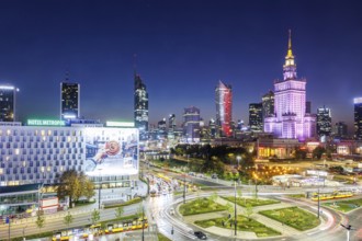 Warsaw skyline skyscrapers with Palace of Culture in the city centre at night in Warsaw, Poland,