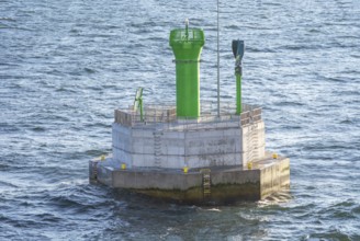 Small lighthouse on navigation mark in Baltic Sea outside Swinoujscie, Poland, Europe