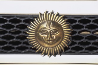 Emblem of sun on car dash, Mumbai, India, Asia