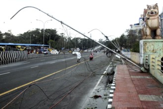 Street lamp post that came in the path of Cyclone Vardah, lie uprooted in Chennai, India on