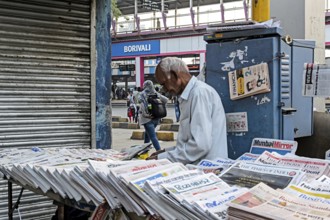 Newspaper vendor at Borivali Railway Station, Mumbai, Maharashtra, India, Asia