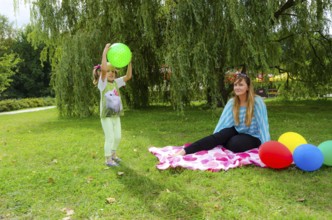 Small girls with aerial balloon