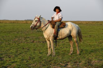 Young Gaucho on his horse at Puesto Mingo, Esteros del Iberá, near Concepción del Yaguareté Corá,