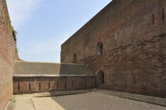 The pentagonal Fort Napoleon with caponier with gun ports and dry ditch in the dunes near Ostend,