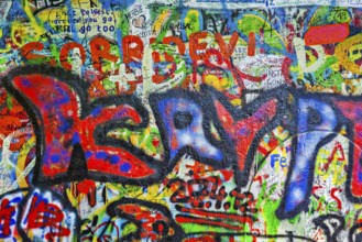 PRAGUE, CZECH REPUBLIC, APRIL 28, 2012: Lennon Wall is filled with John Lennon-inspired graffiti