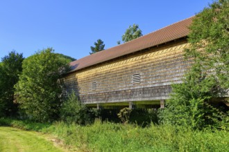 The covered wooden bridge Beuron is a historic bridge over the Danube near the Benedictine