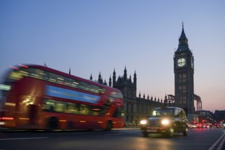 Red double-decker bus on Westminster Bridge, blue hour, Big Ben in the background, Westminster,