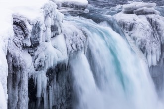 Godafoss waterfall, icy and snowy rock face, Northern Iceland Eyestra, Iceland, Europe