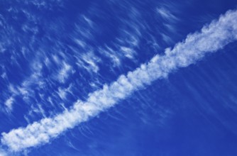 Contrails in the cloudy sky, Austria, Europe