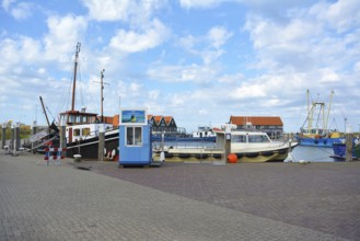 Oudenshield, Texel, Netherlands, June 2017: Harbor with ships on sunny summer day