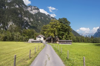 Farm track with farm settlement and Vorauen inn, Klöntal, Canton Glarus, Switzerland, Europe