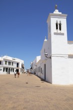 Carrer de ses Escoles and the church of Sant Antoni Abad, Fornells, Es Mercadal, Menorca, Balearic