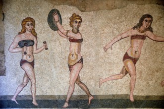 Floor mosaic of three women in bikini during sports, Bikini Girls' Hall, Villa Romana del Casale,