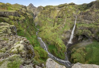 Mountain landscape with canyon, Hangandifoss waterfall in Múlagljúfur Canyon, Sudurland, Iceland,