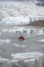 Boats with tourists in the glacier lagoon, ice lagoon Fjallsárlón, ice floes in front of glacier