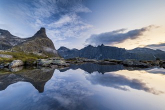 Romsdalshornet mountain reflected in mountain lake, Åndalsnes, Møre og Romsdal, Norway, Europe