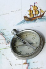 Old compass on map, orientation, discovery, explorer