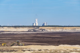 Spoil heaps in the Welzow-Süd opencast lignite mine, with the Schwarze Pumpe power plant in the