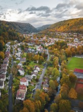 Aerial view of a village in autumn forest, Hirsau, Calw, Black Forest, Germany, Europe