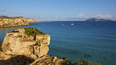 Rock, sailing boats, Levanzo Island, Scogliera di Cala Rossa, Cala Rossa, Favignana, Egadi Islands,