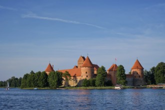 Trakai Island Castle in lake Galve with boats and yachts in summer day with beautiful sky,