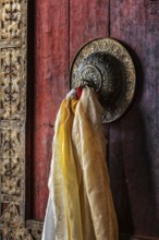 Decorated door handle of gates of Thiksey gompa (Tibetan Buddhist monastery) . Ladakh, India, Asia