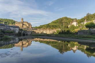 Medieval bridge over Lot with castle in village of Estaing. Aveyron, France, Europe