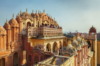 JAIPUR, INDIA, NOVEMBER 18, 2012: Tourist visiting Hawa Mahal palace (Palace of the Winds) famous