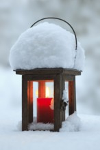 Lantern with burning candle