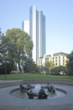 Sculpture and fountain Marshallbrunnen by Toni Stadler 1968 and skyscraper Deutsche Bank Soll und