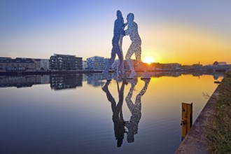 Molecule Man, monumental artwork in the Spree at sunrise, artist Jonathan Borofsky, Berlin,