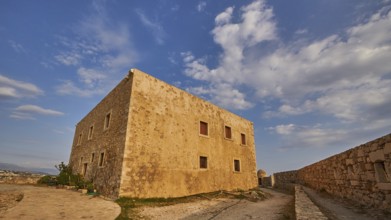 Fortezza, Venetian sea fortress, super wide angle shot, building, fortress wall, blue sky, few