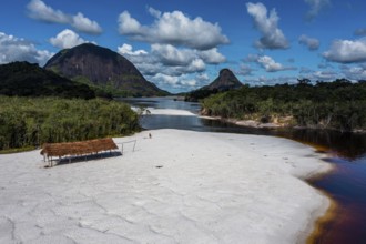 Black river and white sand beach before the granite hills, Cerros de Mavecure, Eastern Colombia