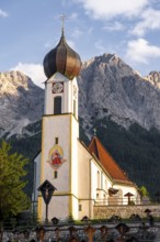 Cemetery and church of St. John the Baptist, mountain peak of the Wetterstein Mountains at the