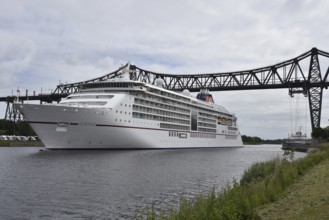 Cruise ship Europa 2 under the Rendsburg Bridge on the Kiel Canal, Schleswig-Holstein, Germany,